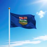 Waving flag of Alberta is a province of Canada on flagpole photo