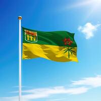 Waving flag of Saskatchewan is a province of Canada on flagpole photo