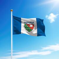 Waving flag of Northwest Territories is a province of Canada on flagpole photo