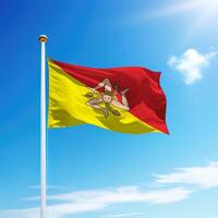 Waving flag of Sicily is a region of Italy on flagpole photo