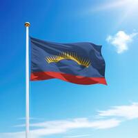 Waving flag of Murmansk is a region of Russia on flagpole photo