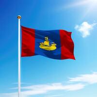 Waving flag of Kostroma is a region of Russia on flagpole photo