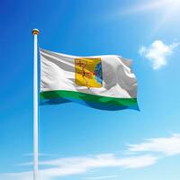 Waving flag of Kirov is a region of Russia on flagpole photo