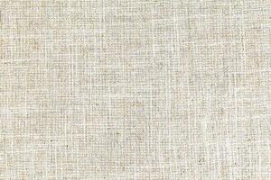 Natural linen material textile canvas Fabric texture background Close-up detail of fabric natural color Hemp material pattern design wallpaper. can be used as background or for graphic design photo