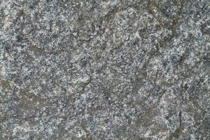 Abstract natural rock stone granite grunge rusty metal texture design background natural color stone material granite design wallpaper. Close-up detail of natural stone photo