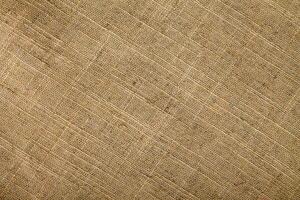 Natural linen material textile canvas Fabric texture background Close-up detail of fabric natural color Hemp material pattern design wallpaper. can be used as background or for graphic design photo