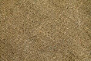 Natural linen material textile canvas Fabric texture background Close-up detail of fabric natural color Hemp material pattern design wallpaper. can be used as background or for graphic design photo