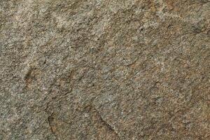 Abstract natural rock stone granite grunge rusty metal texture design background natural color stone material granite design wallpaper. Close-up detail of natural stone photo