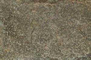Abstract natural rock stone granite grunge rusty metal texture design background natural color stone material granite design wallpaper. Close-up detail of natural stone photo
