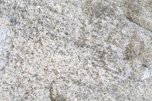 Abstract natural rock stone granite grunge rusty metal texture design background natural color stone material granite design wallpaper. Close-up detail of natural stone photo