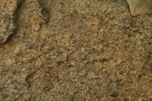 Abstract natural rock stone granite grunge rusty metal texture design background natural color stone material granite design wallpaper. Close-up detail of natural stone photo