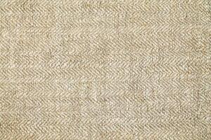 Natural linen material textile canvas Fabric texture background Close-up detail of fabric natural color Hemp material pattern design wallpaper. can be used as background or for graphic design photo