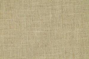 Natural linen material textile canvas Fabric texture background Close-up detail of fabric natural color Hemp material pattern design wallpaper. can be used as background or for graphic design photo