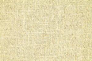 Natural linen material textile canvas Fabric texture background Close-up detail of fabric natural color Hemp material pattern design wallpaper. can be used as background or for graphic design photo