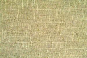 Natural linen material textile canvas Fabric texture background Close-up detail of fabric natural color Hemp material pattern design wallpaper. can be used as background or for graphic design photo