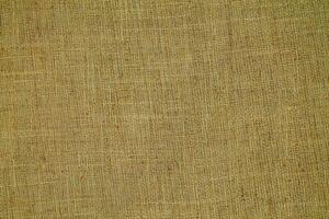 Natural linen material textile canvas Fabric texture background Close-up detail of fabric natural color Hemp material pattern design wallpaper. can be used as background or for graphic design photo