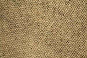 Natural linen material textile canvas Fabric texture background Close-up detail of fabric natural color Hemp material pattern design wallpaper. can be used as background or for graphic design photo