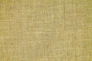Natural linen material textile canvas Fabric texture background Close-up detail of fabric natural color Hemp material pattern design wallpaper. can be used as background or for graphic design photo