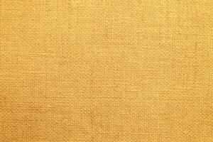 Natural linen material textile canvas Fabric texture background Close-up detail of fabric natural color Hemp material pattern design wallpaper. can be used as background or for graphic design photo