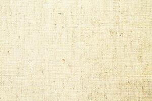 Natural linen material textile canvas Fabric texture background Close-up detail of fabric natural color Hemp material pattern design wallpaper. can be used as background or for graphic design photo