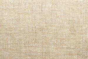 Natural linen material textile canvas Fabric texture background Close-up detail of fabric natural color Hemp material pattern design wallpaper. can be used as background or for graphic design photo