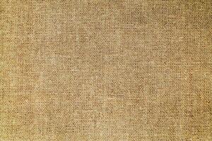 Natural linen material textile canvas Fabric texture background Close-up detail of fabric natural color Hemp material pattern design wallpaper. can be used as background or for graphic design photo