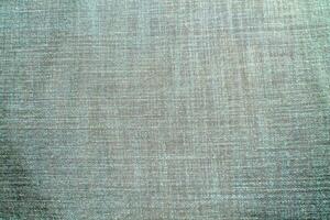 Natural linen material textile canvas Fabric texture background Close-up detail of fabric natural color Hemp material pattern design wallpaper. can be used as background or for graphic design photo