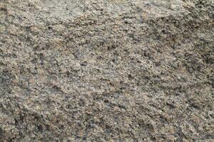 Abstract natural rock stone granite grunge rusty metal texture design background natural color stone material granite design wallpaper. Close-up detail of natural stone photo