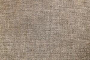 Natural linen material textile canvas Fabric texture background Close-up detail of fabric natural color Hemp material pattern design wallpaper. can be used as background or for graphic design photo