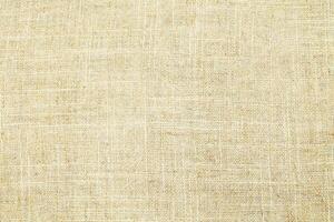 Natural linen material textile canvas Fabric texture background Close-up detail of fabric natural color Hemp material pattern design wallpaper. can be used as background or for graphic design photo