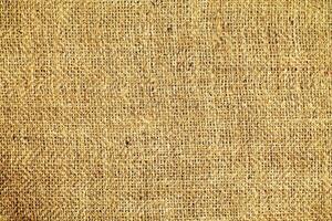 Natural linen material textile canvas Fabric texture background Close-up detail of fabric natural color Hemp material pattern design wallpaper. can be used as background or for graphic design photo