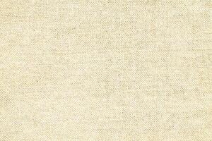 Natural linen material textile canvas Fabric texture background Close-up detail of fabric natural color Hemp material pattern design wallpaper. can be used as background or for graphic design photo