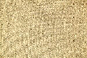 Natural linen material textile canvas Fabric texture background Close-up detail of fabric natural color Hemp material pattern design wallpaper. can be used as background or for graphic design photo