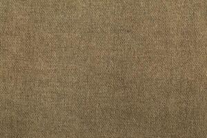 Natural linen material textile canvas Fabric texture background Close-up detail of fabric natural color Hemp material pattern design wallpaper. can be used as background or for graphic design photo