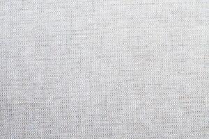 Natural linen material textile canvas Fabric texture background Close-up detail of fabric natural color Hemp material pattern design wallpaper. can be used as background or for graphic design photo