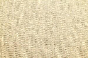 Natural linen material textile canvas Fabric texture background Close-up detail of fabric natural color Hemp material pattern design wallpaper. can be used as background or for graphic design photo