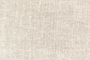 Natural linen material textile canvas Fabric texture background Close-up detail of fabric natural color Hemp material pattern design wallpaper. can be used as background or for graphic design photo