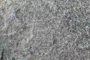 Abstract natural rock stone granite grunge rusty metal texture design background natural color stone material granite design wallpaper. Close-up detail of natural stone photo