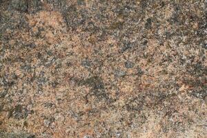 Abstract natural rock stone granite grunge rusty metal texture design background natural color stone material granite design wallpaper. Close-up detail of natural stone photo