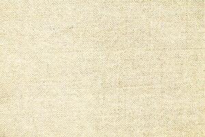 Natural linen material textile canvas Fabric texture background Close-up detail of fabric natural color Hemp material pattern design wallpaper. can be used as background or for graphic design photo