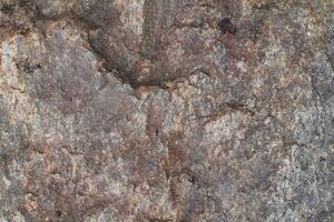Abstract natural rock stone granite grunge rusty metal texture design background natural color stone material granite design wallpaper. Close-up detail of natural stone photo