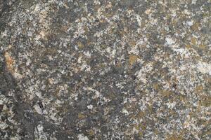 Abstract natural rock stone granite grunge rusty metal texture design background natural color stone material granite design wallpaper. Close-up detail of natural stone photo