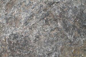 Abstract natural rock stone granite grunge rusty metal texture design background natural color stone material granite design wallpaper. Close-up detail of natural stone photo