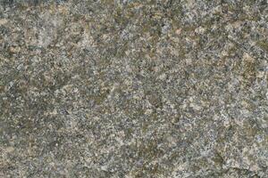 Abstract natural rock stone granite grunge rusty metal texture design background natural color stone material granite design wallpaper. Close-up detail of natural stone photo