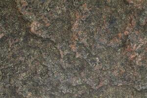 Abstract natural rock stone granite grunge rusty metal texture design background natural color stone material granite design wallpaper. Close-up detail of natural stone photo