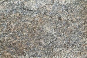 Abstract natural rock stone granite grunge rusty metal texture design background natural color stone material granite design wallpaper. Close-up detail of natural stone photo