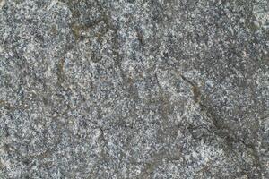 Abstract natural rock stone granite grunge rusty metal texture design background natural color stone material granite design wallpaper. Close-up detail of natural stone photo