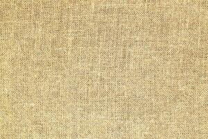 Natural linen material textile canvas Fabric texture background Close-up detail of fabric natural color Hemp material pattern design wallpaper. can be used as background or for graphic design photo