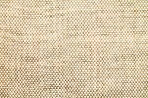 Natural linen material textile canvas Fabric texture background Close-up detail of fabric natural color Hemp material pattern design wallpaper. can be used as background or for graphic design photo