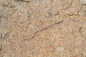 Abstract natural rock stone granite grunge rusty metal texture design background natural color stone material granite design wallpaper. Close-up detail of natural stone photo